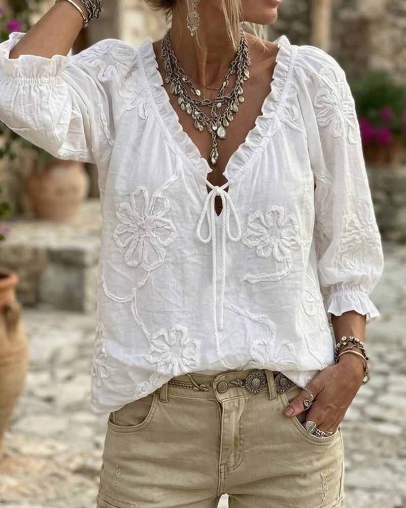 Blusa de algodón 100%, escote en V envolvente, con lazo y volantes