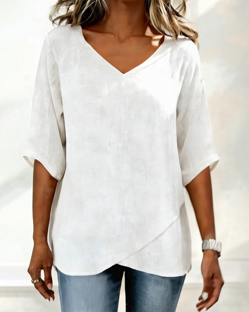 Top con dobladillo irregular, color liso, cuello en V