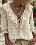Blusa de jacquard con lunares y mangas globo, escote en V