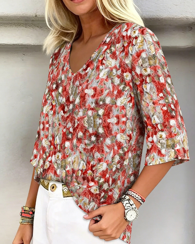 Blusa estampada floral escote en V manga tres cuartos