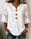 Blusa con estampado de margaritas y mangas con volantes