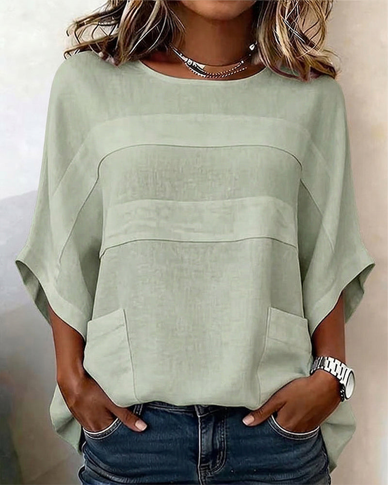 Blusa 100% algodón, mangas murciélago, corte holgado, cuello redondo