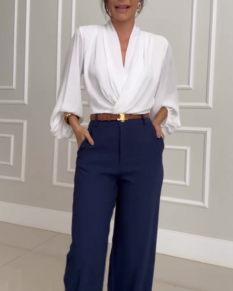 Blusa de moda con mangas farol y escote en V de color sólido