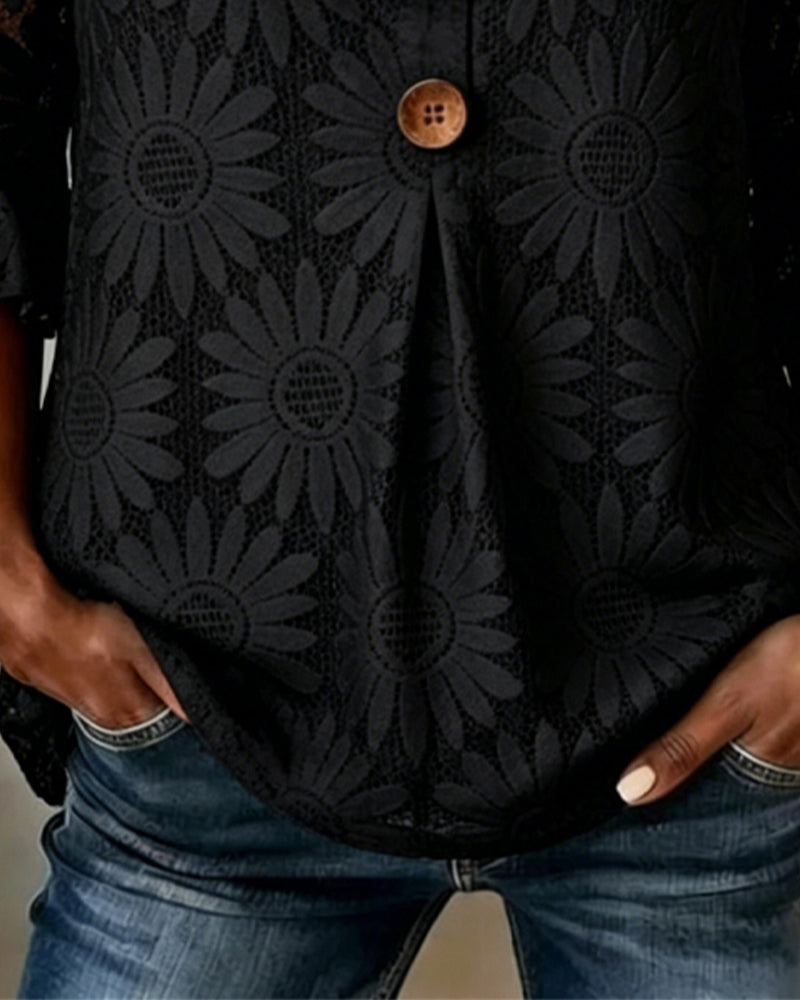 Blusa con estampado de margaritas y mangas con volantes