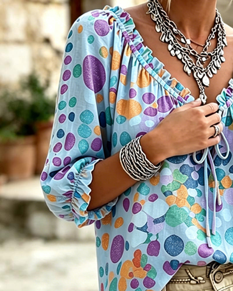 Blusa de escote en V con lunares y lazos